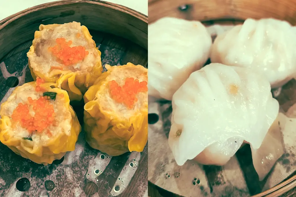 Left: Close-up, top-down angle of steamed chicken siu mai dim sum in a bamboo basket, each dumpling topped with bright orange roe, showing moist textured filling and glossy yellow wrappers with visible steam droplets on the metal tray beneath. Right: Close-up, eye-level angle of crystal shrimp dumplings (har gow) with smooth translucent skins, slightly glossy from steam, arranged in a bamboo steamer with soft lighting highlighting their delicate folds and plump interiors.